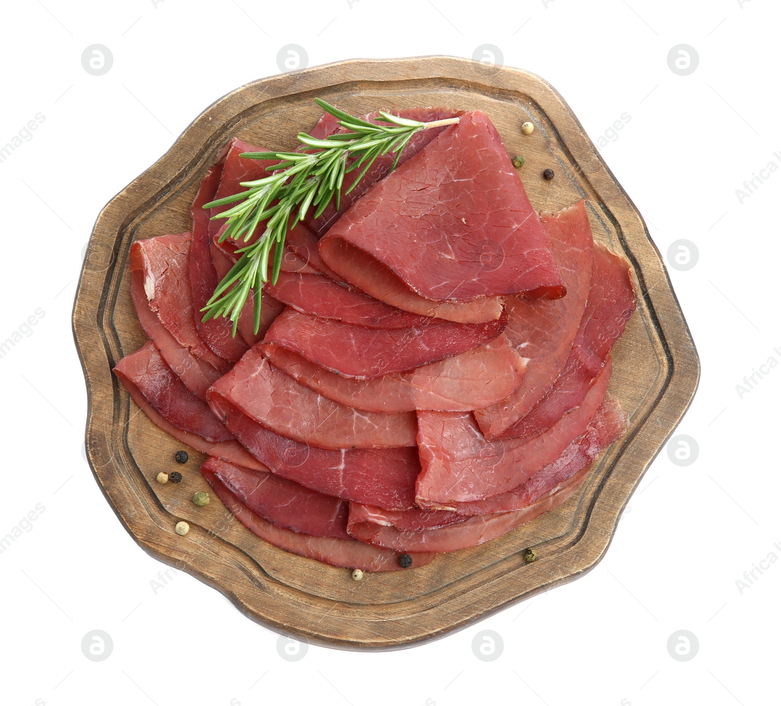 Photo of Slices of tasty bresaola, peppercorns and rosemary isolated on white, top view