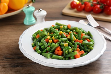 Photo of Mix of fresh vegetables served on  wooden table