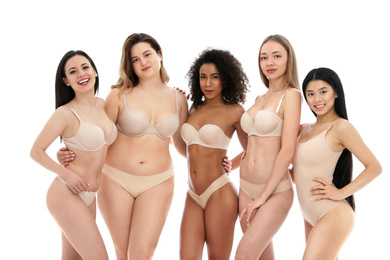 Photo of Group of women with different body types in underwear on white background