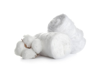 Photo of Fluffy cotton rolls and flower on white background