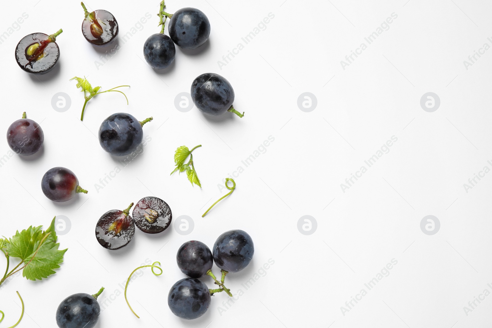 Photo of Fresh ripe juicy grapes on white background, top view