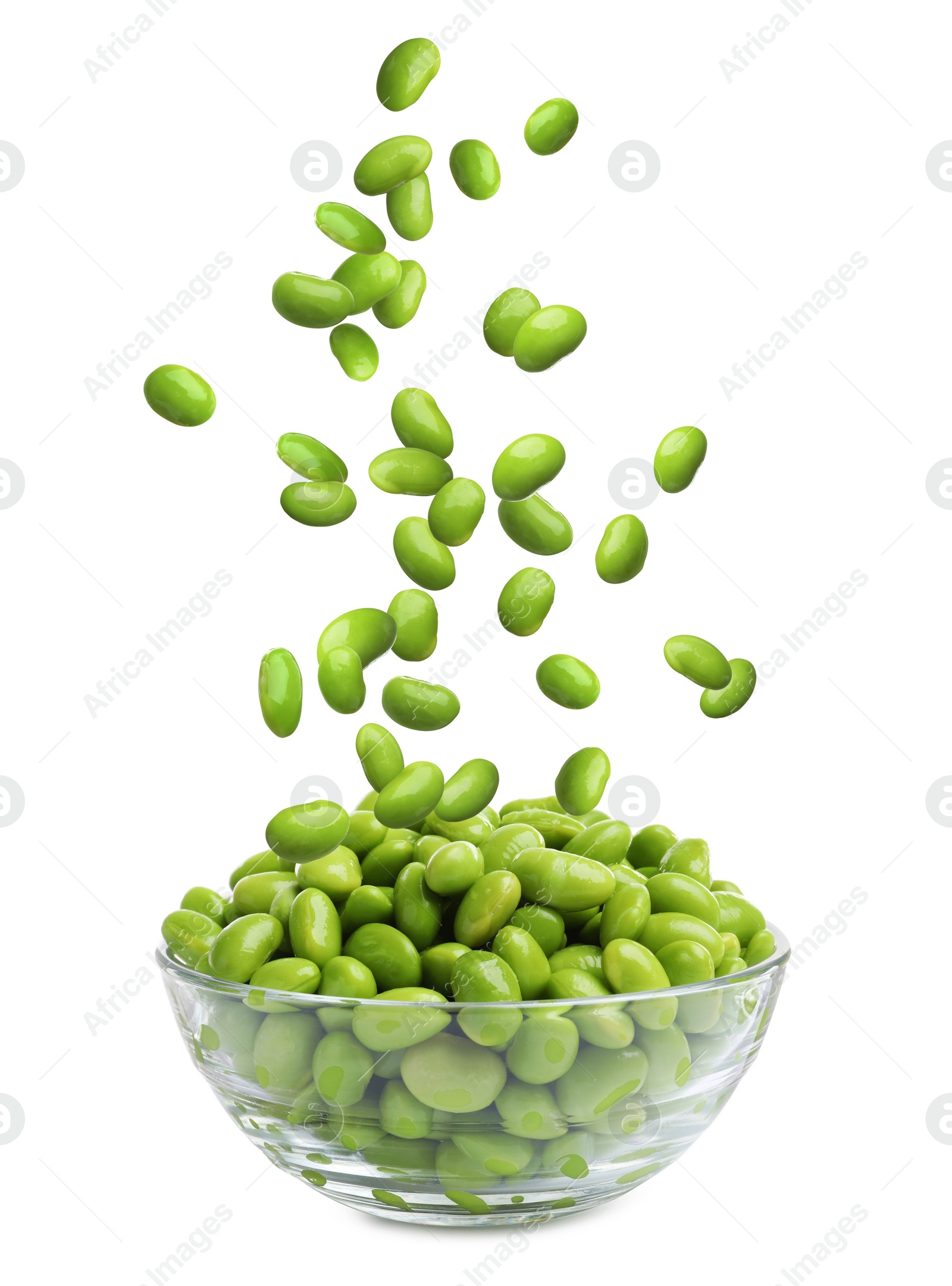 Image of Delicious edamame soybeans falling into bowl on white background