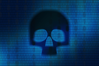 Dark skull on digital binary code background. Cyber attack prevention concept