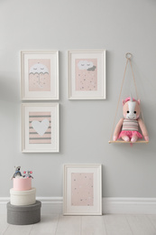 Photo of Children's room interior with toys and cute pictures on wall
