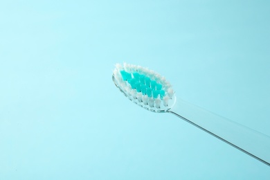 Manual toothbrush on color background. Dental care