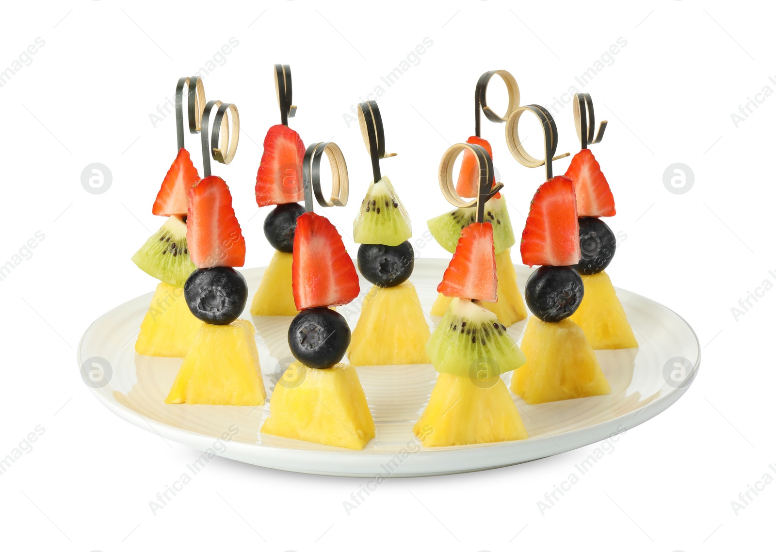 Photo of Tasty canapes with pineapple, kiwi and berries isolated on white