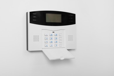 Home security alarm system on white wall