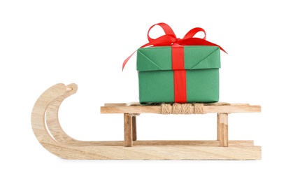 Wooden sleigh with gift box isolated on white. Christmas holiday decor