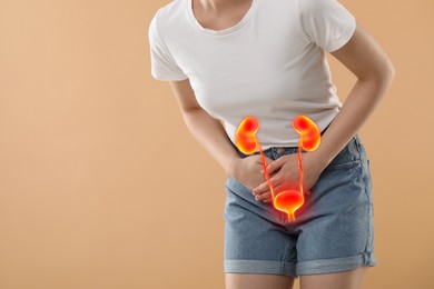 Woman suffering from cystitis on beige background, closeup. Illustration of urinary system