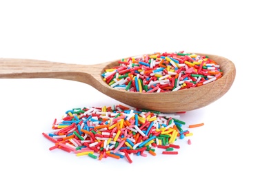 Photo of Colorful sprinkles and wooden spoon on white background. Confectionery decor