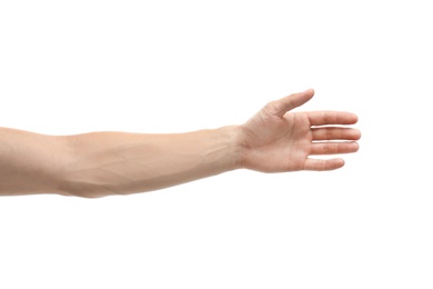 Photo of Young man held out hand on white background, closeup