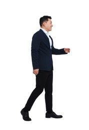 Photo of Businessman in suit walking on white background