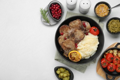 Photo of Tasty beef tongue pieces, berries, mashed potatoes and ingredients on white table, flat lay. Space for text
