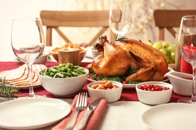 Photo of Traditional festive dinner with delicious roasted turkey served on table