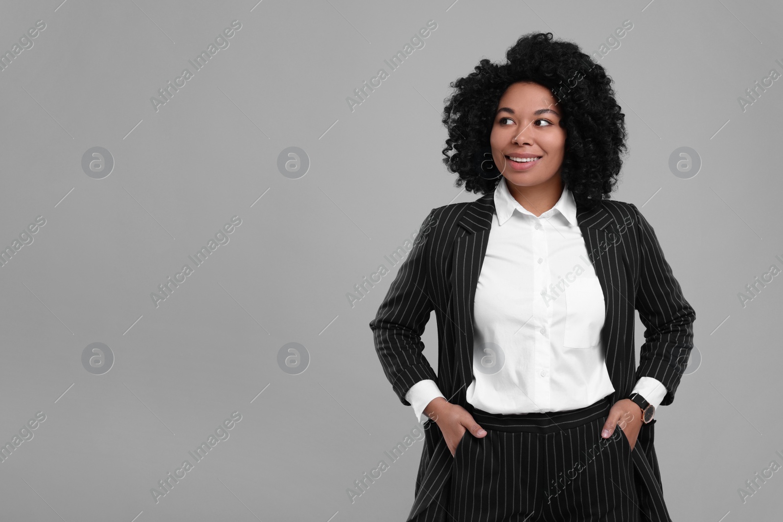 Photo of Young businesswoman in formal outfit on grey background. Space for text