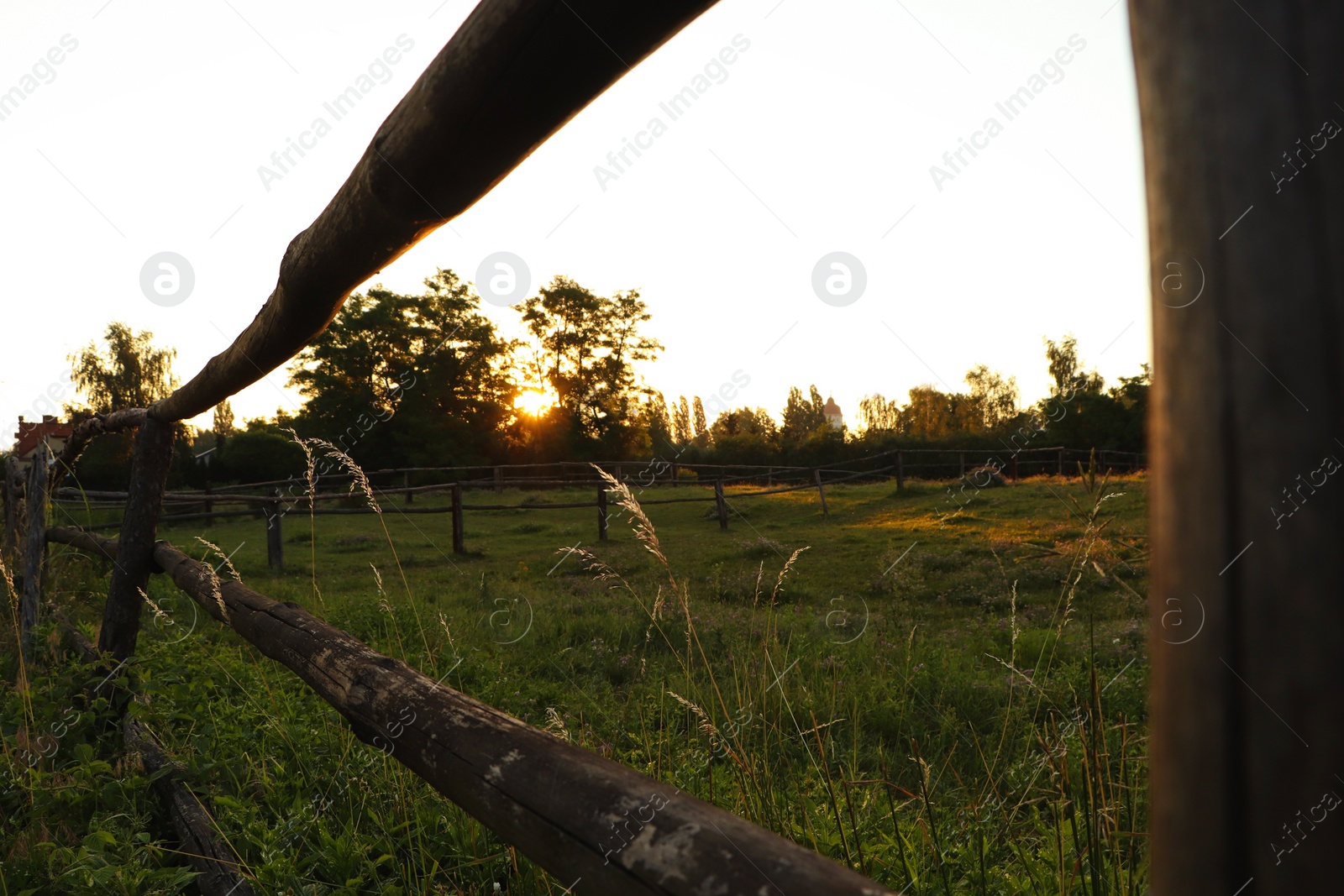 Photo of Picturesque view of countryside with wooden fence in morning