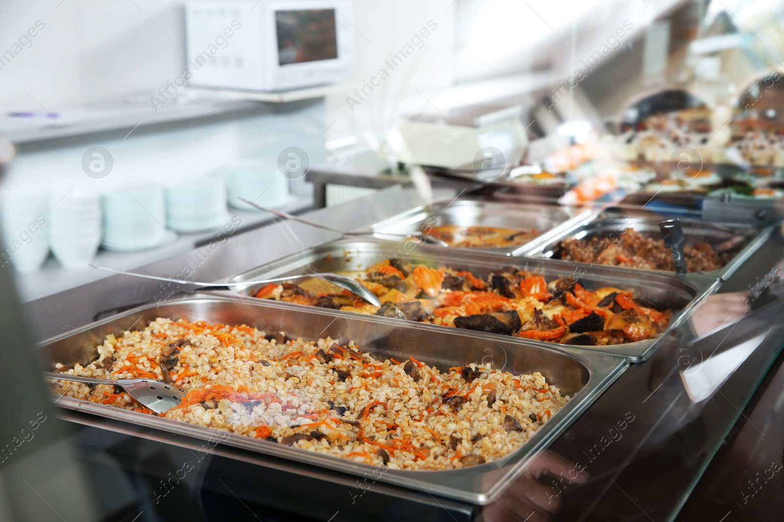 Photo of Containers with healthy food in school canteen