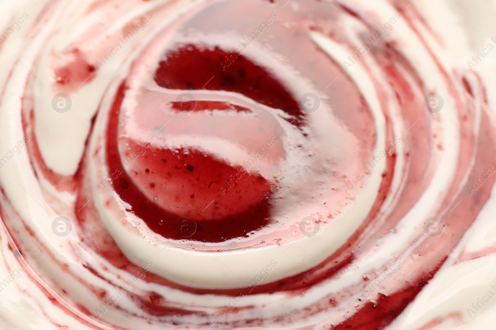 Photo of Tasty yoghurt with jam as background, closeup