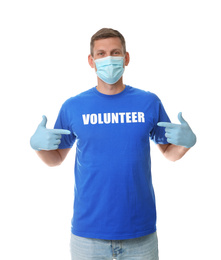 Male volunteer in mask and gloves on white background. Protective measures during coronavirus quarantine