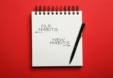 Image of Notebook with two opposite directions to Old and New Habits on red background, top view