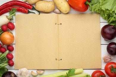 Blank recipe book and different ingredients on white wooden table, flat lay. Space for text