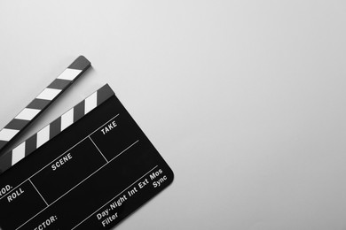 Photo of Clapperboard on gray background, top view. Space for text