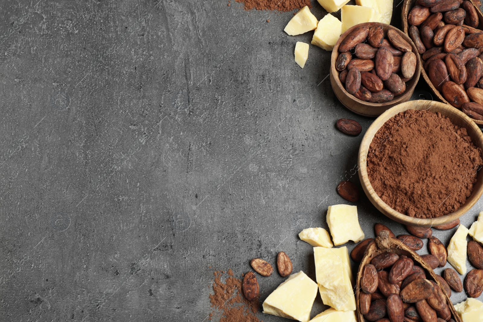 Photo of Flat lay composition with organic cocoa butter on grey table. Space for text