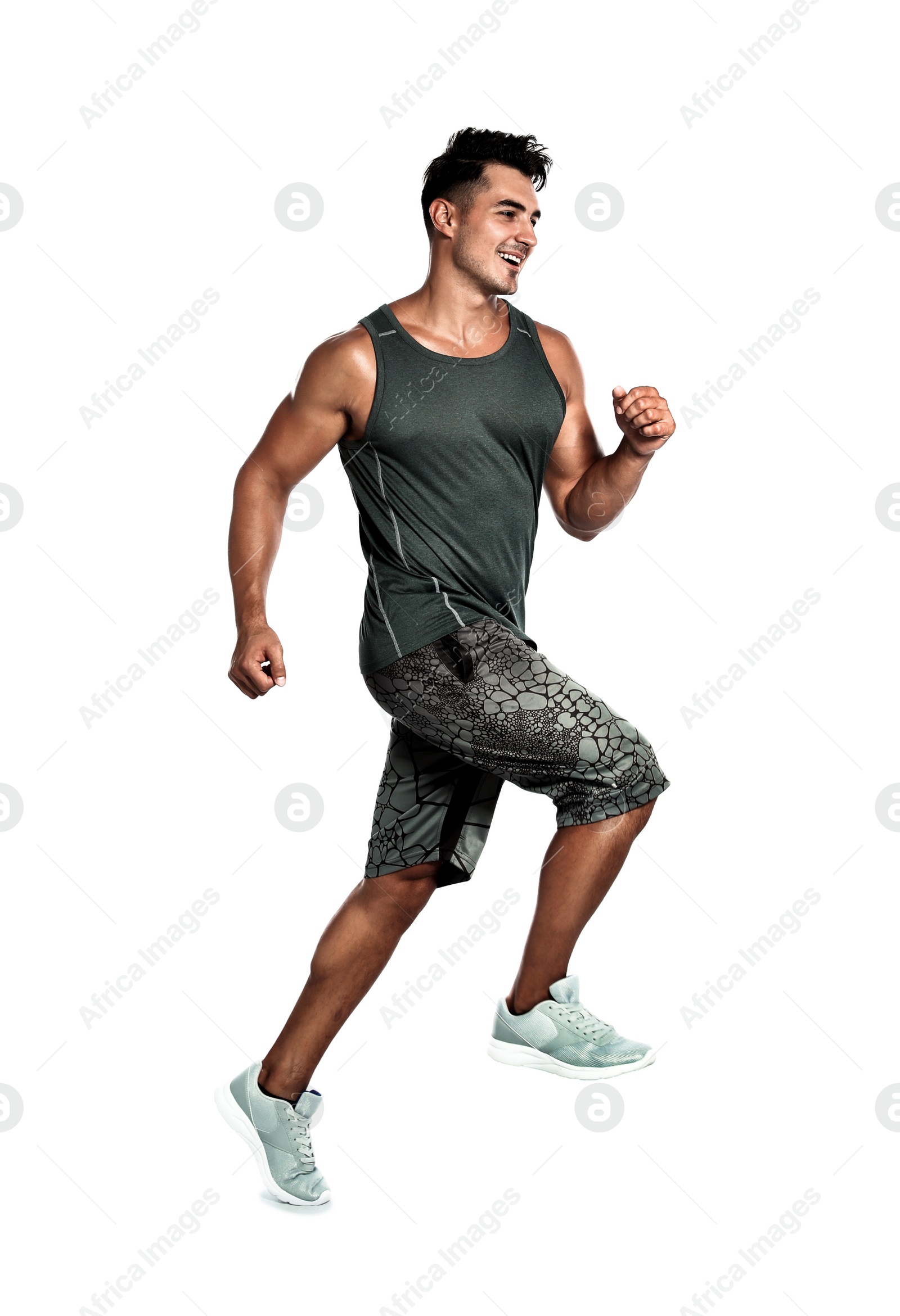 Photo of Handsome young man running on white background