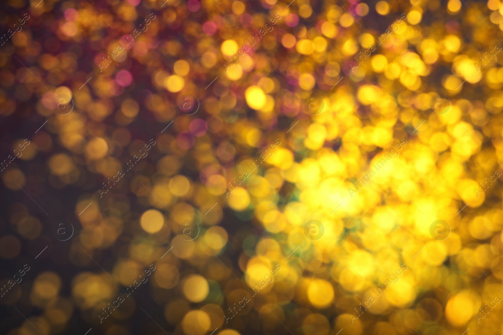 Photo of Blurred view of shiny glitter as background. Bokeh effect