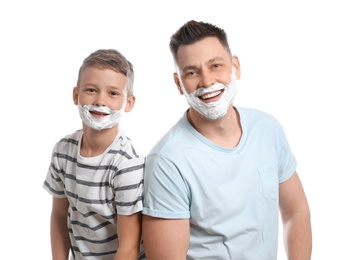 Happy dad and son with shaving foam on faces, white background