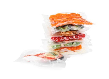 Photo of Vacuum packs with different food products on white background