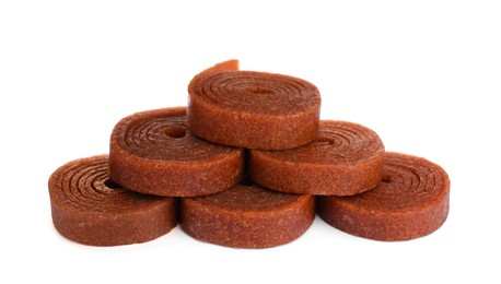 Photo of Delicious fruit leather rolls on white background