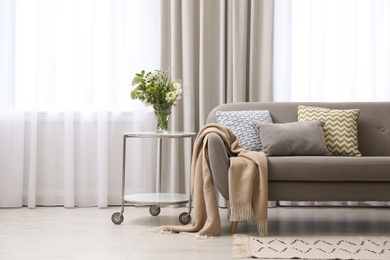 Photo of Modern living room interior with beautiful curtains on window