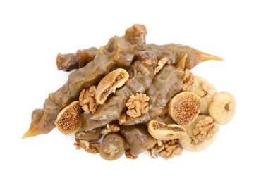 Photo of Delicious sweet churchkhelas with walnuts and dried figs isolated on white, top view