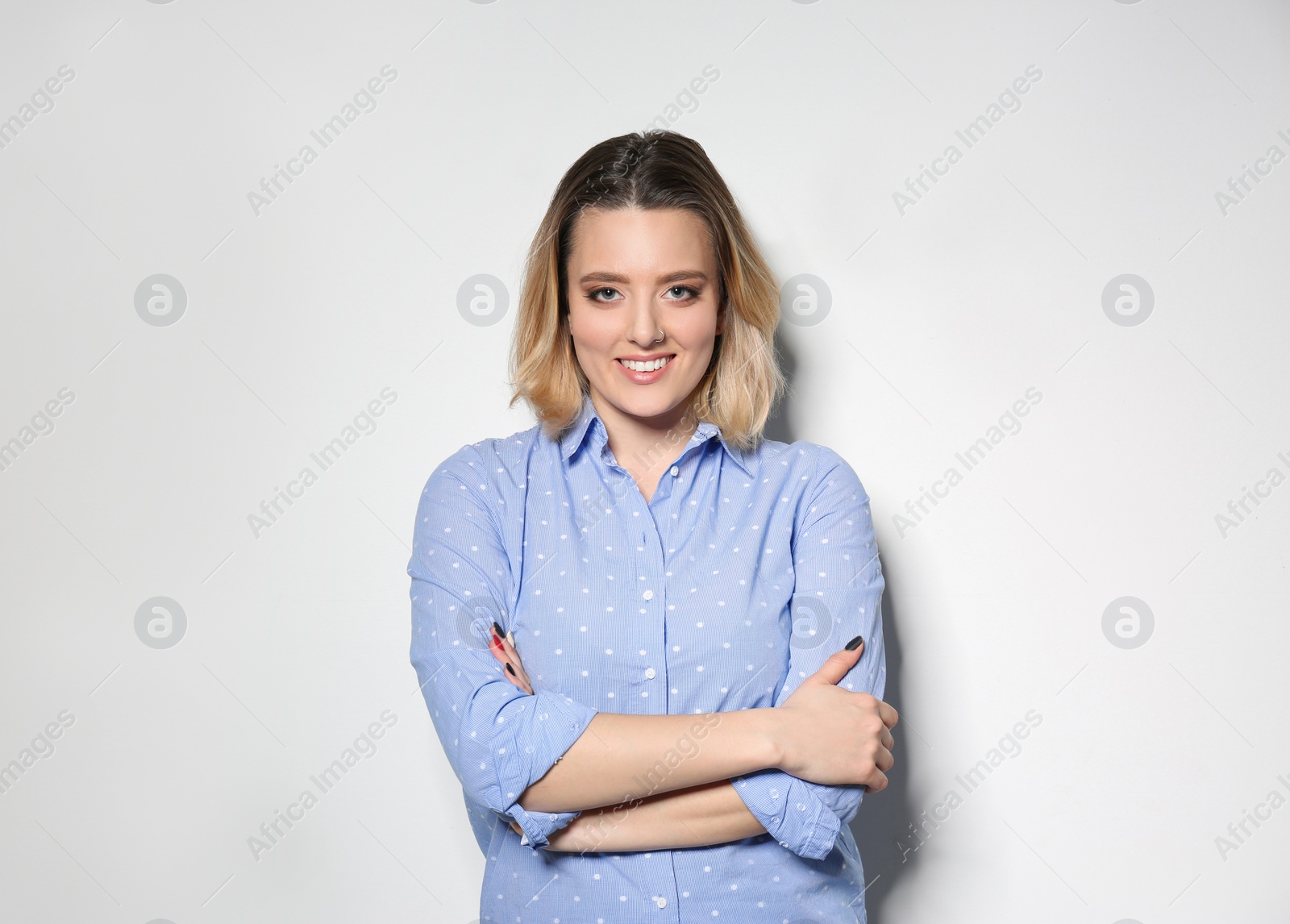 Photo of Portrait of attractive woman on light background