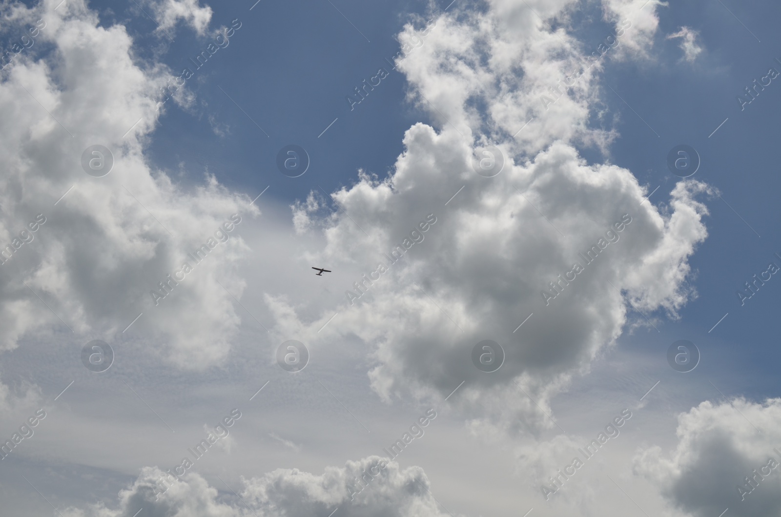 Photo of Modern airplane flying in sky with clouds