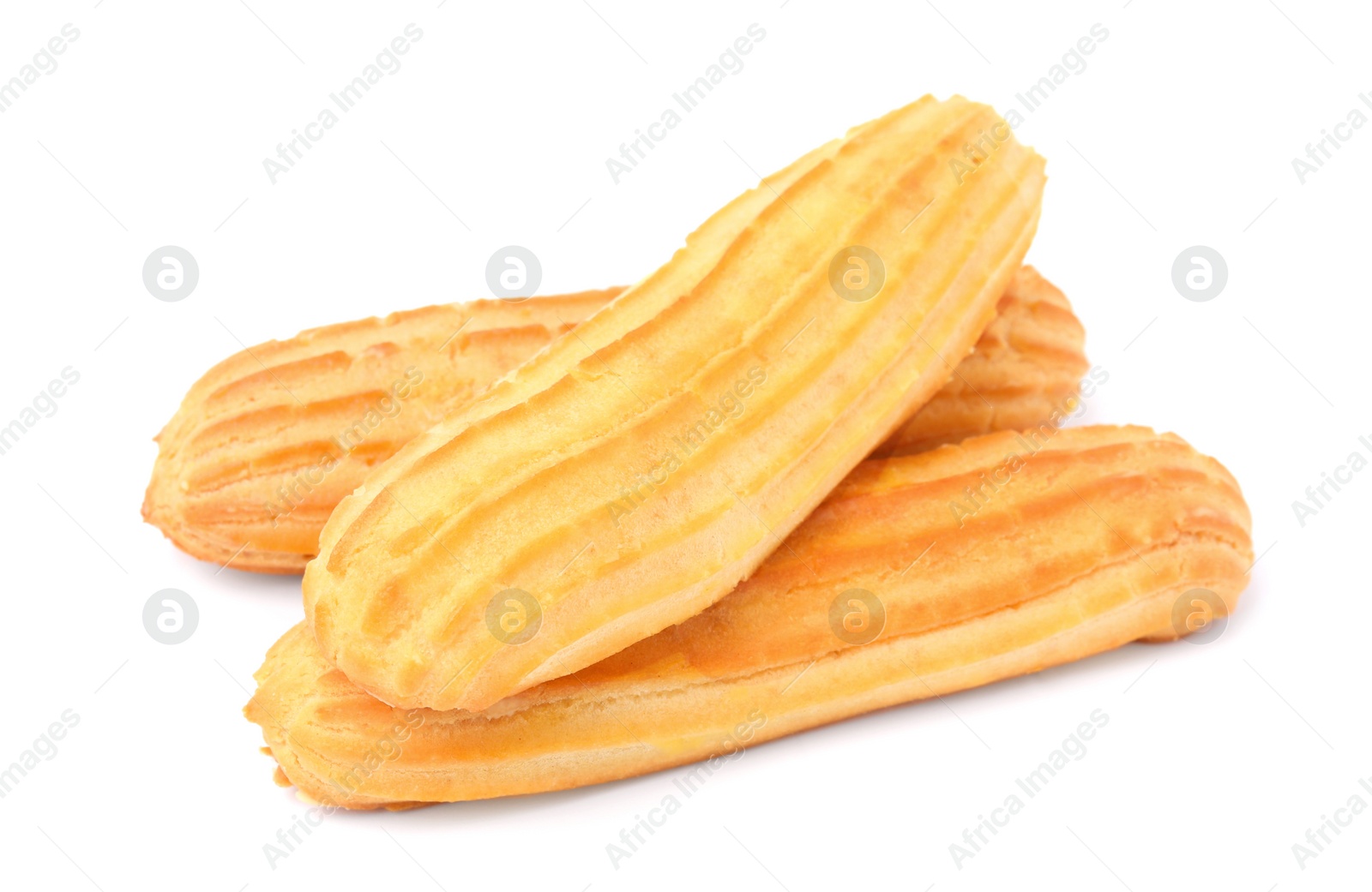 Photo of Three fresh delicious eclairs isolated on white