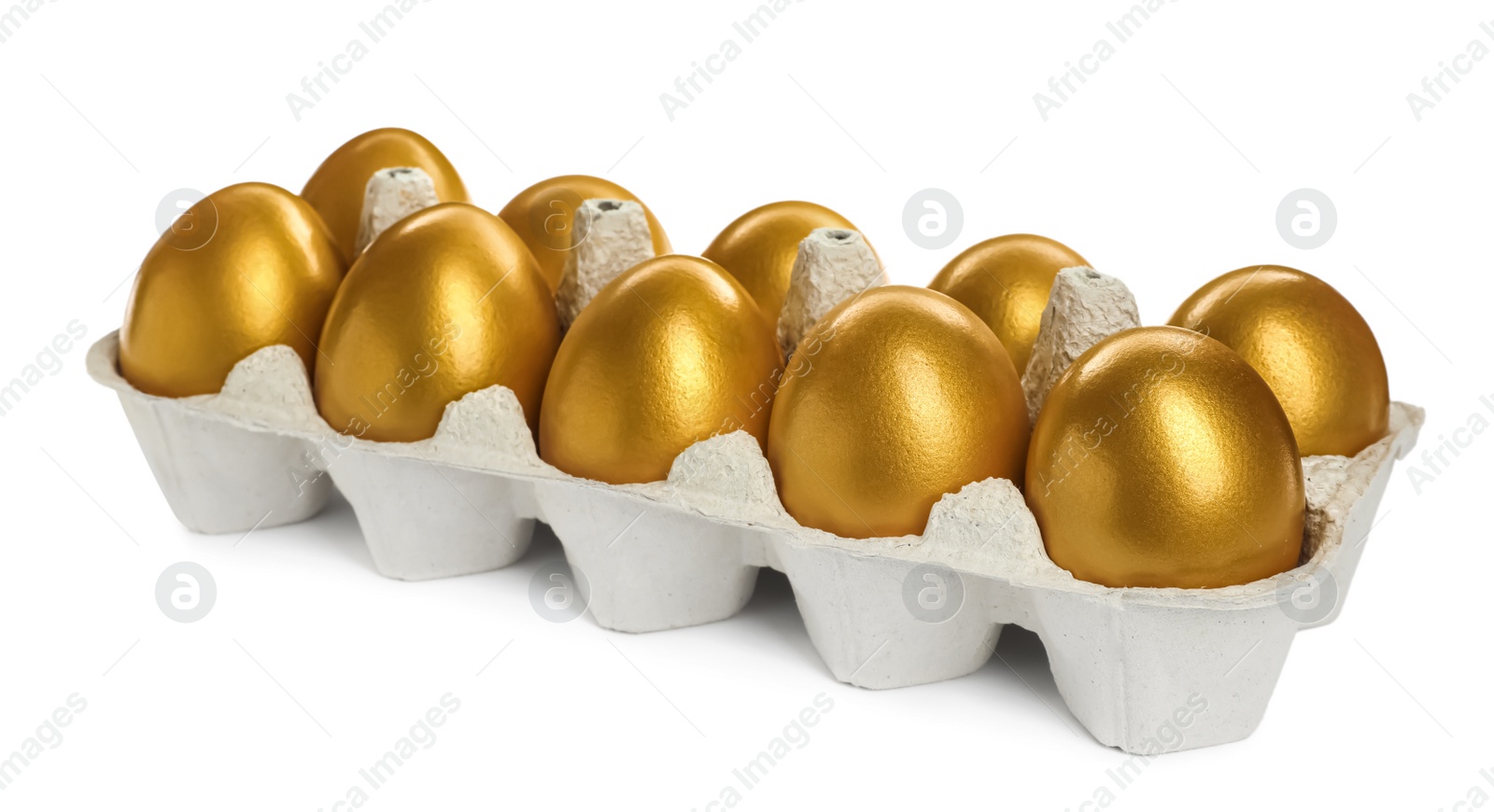 Photo of Many shiny golden eggs in carton on white background