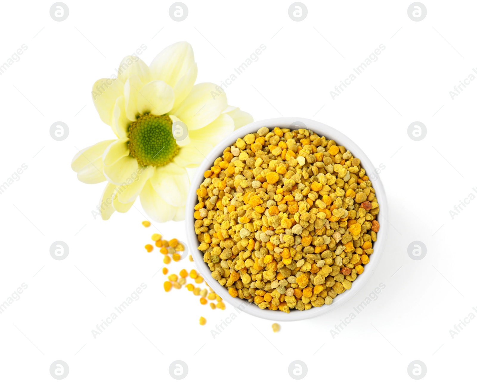 Photo of Fresh bee pollen granules and flower isolated on white, top view