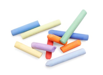 Photo of Colorful pastels on white background, top view. Drawing materials