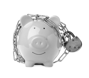 Photo of Piggy bank with steel chain and padlock isolated on white. Money safety concept