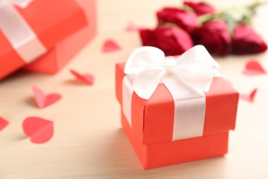 Photo of Beautiful gift box on wooden table, closeup. Valentine's Day celebration