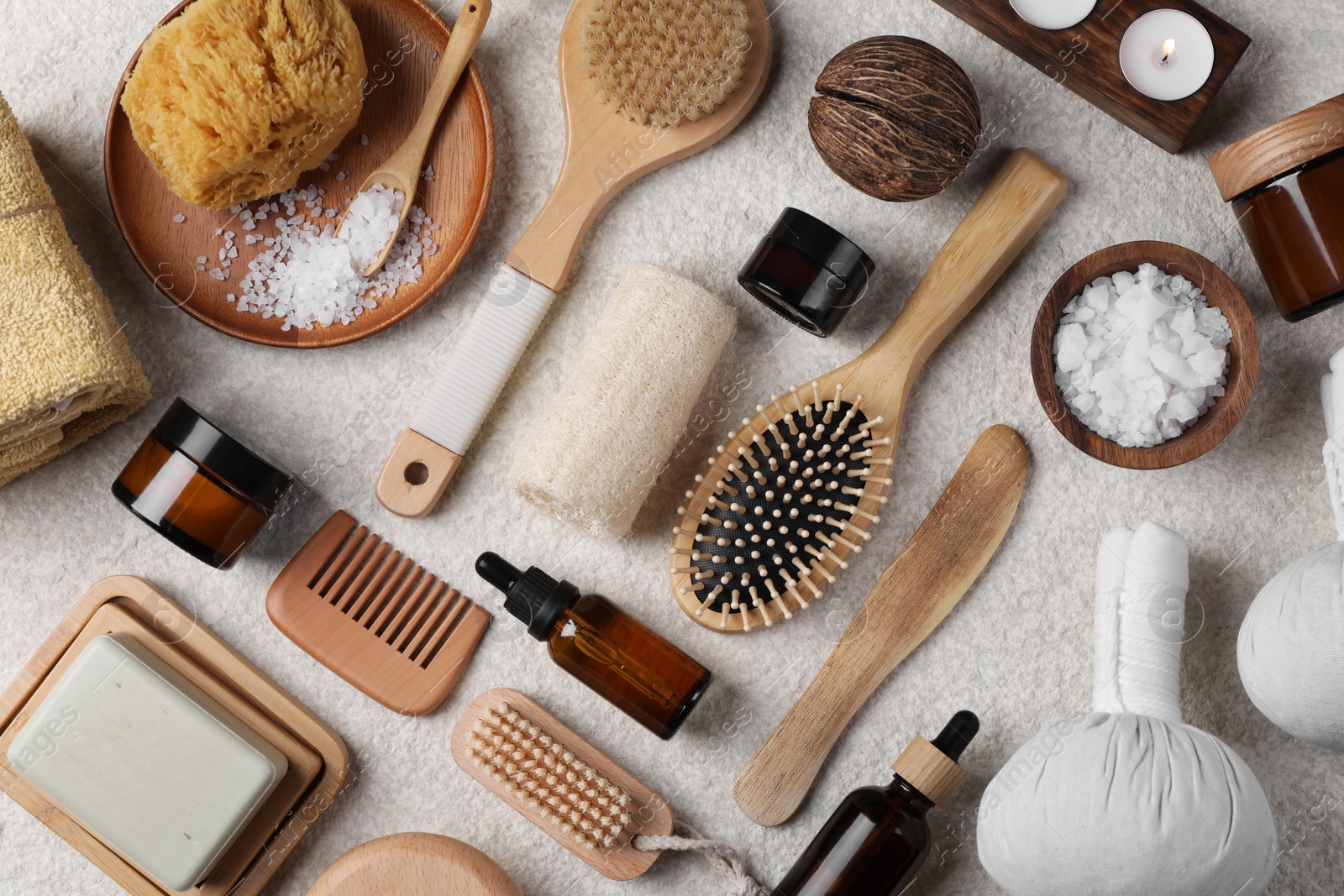 Photo of Flat lay composition with different spa products on light grey textured table