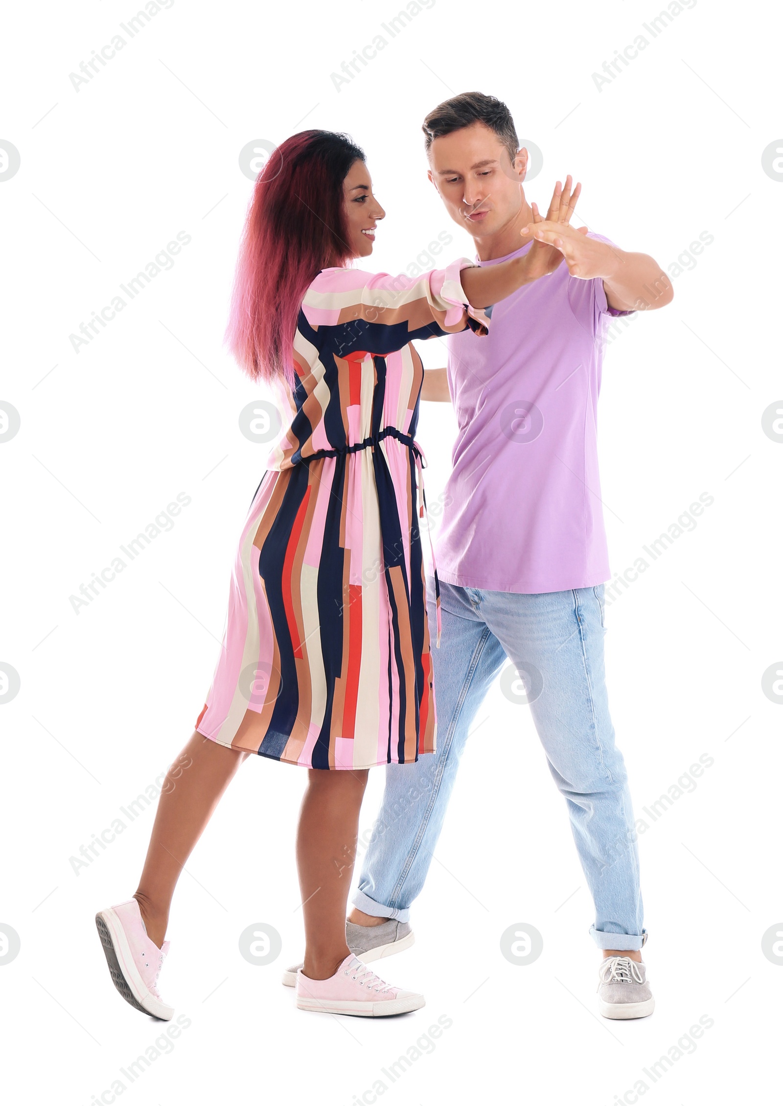 Photo of Beautiful lovely couple dancing on white background