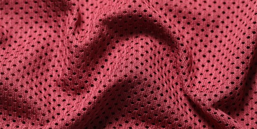 Photo of Texture of burgundy fabric as background, closeup