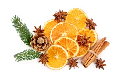 Photo of Dry orange slices, fir branches, cinnamon sticks and anise stars isolated on white, top view
