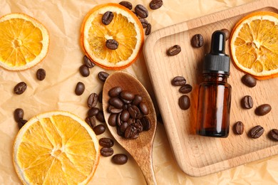 Photo of Flat lay composition with bottle of organic cosmetic product, coffee beans and dried orange slices on parchment paper