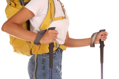 Photo of Woman with backpack and trekking poles on white background, closeup