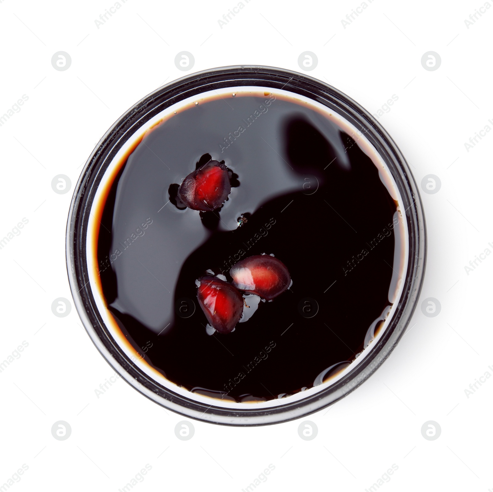 Photo of Tasty pomegranate sauce with seeds in bowl isolated on white, top view