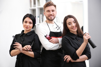 Photo of Professional hairdressers in salon